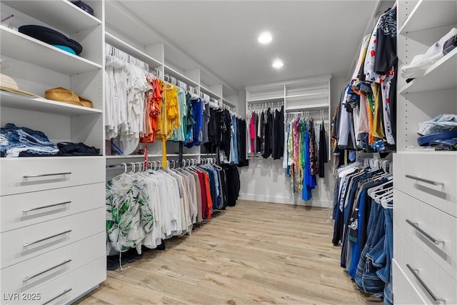 walk in closet featuring light hardwood / wood-style floors