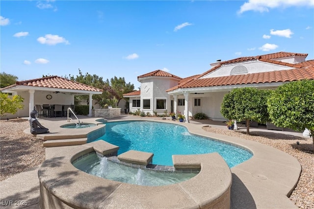 view of pool featuring an in ground hot tub and a patio area