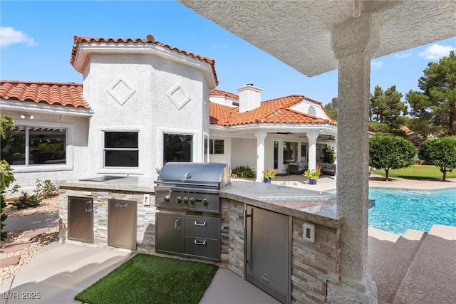 view of patio / terrace featuring ceiling fan, grilling area, and area for grilling