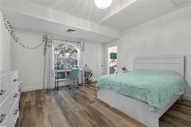 bedroom with hardwood / wood-style floors