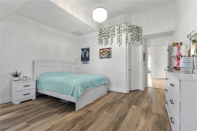 bedroom featuring hardwood / wood-style floors