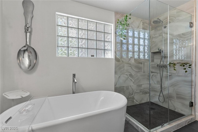 bathroom with shower with separate bathtub