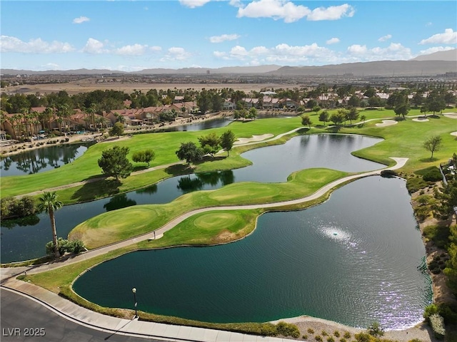 bird's eye view with a water and mountain view