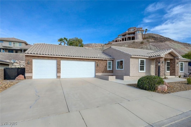 view of front of home featuring a garage and a mountain view