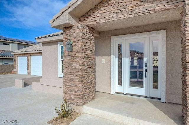 property entrance featuring a garage