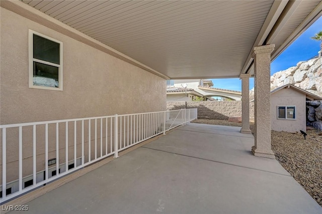 view of patio with a storage unit