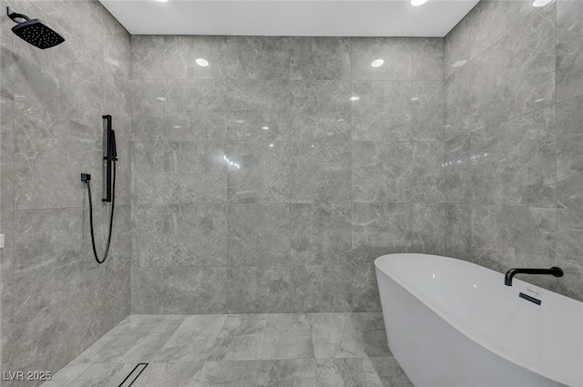 bathroom with separate shower and tub