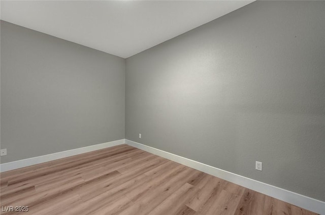 spare room with light wood-type flooring