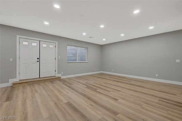 foyer entrance with light wood-type flooring