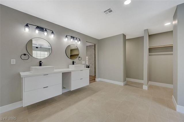 bathroom featuring tile patterned floors and vanity