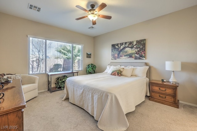 bedroom with light carpet and ceiling fan