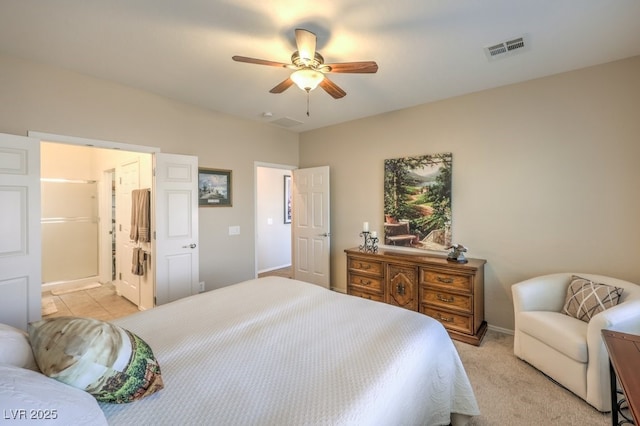 carpeted bedroom featuring ceiling fan and connected bathroom