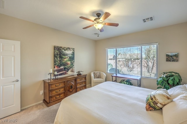 bedroom featuring ceiling fan and light carpet