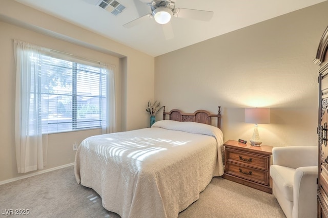 bedroom with ceiling fan and light colored carpet