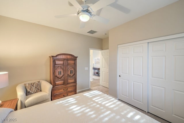 bedroom featuring ceiling fan and a closet