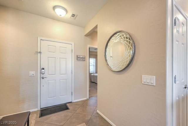 entrance foyer featuring light tile patterned flooring