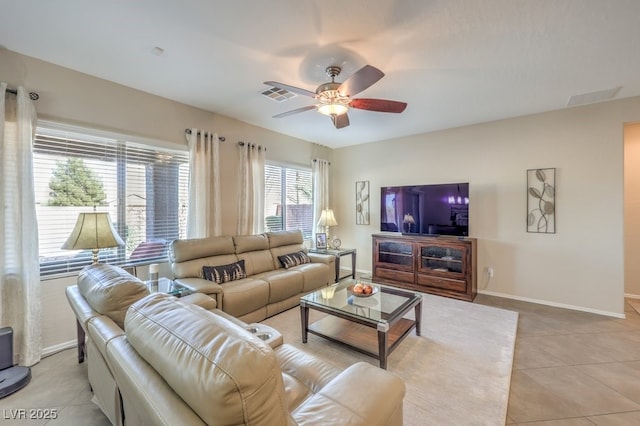 living room featuring ceiling fan and light tile patterned floors