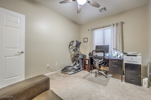 carpeted home office with ceiling fan and vaulted ceiling