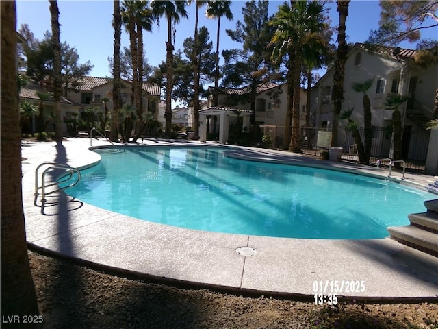 view of swimming pool featuring a patio area