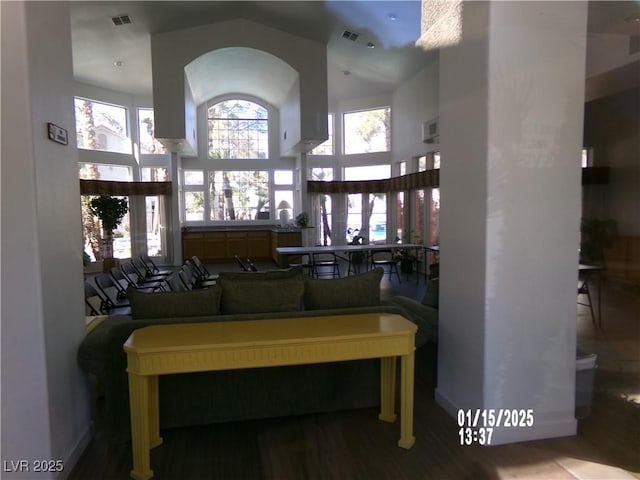 living room with a high ceiling