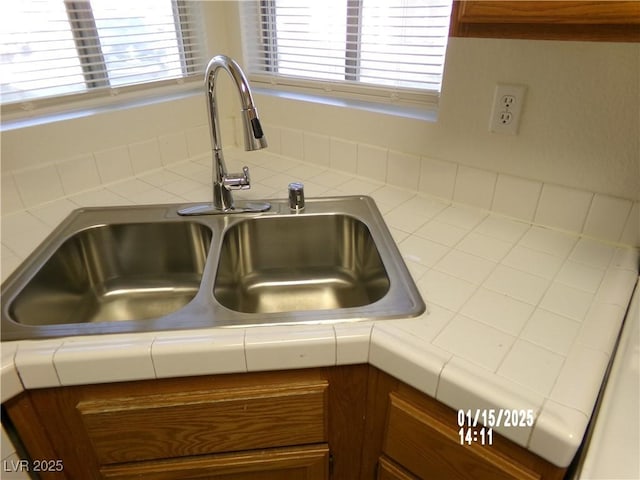 details featuring sink and tile counters