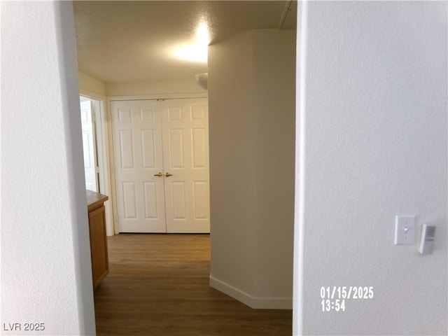 hallway featuring dark wood-type flooring