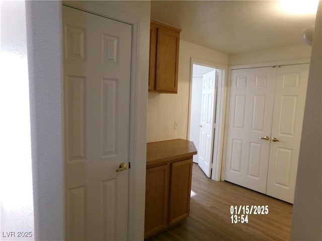 hall with light hardwood / wood-style flooring