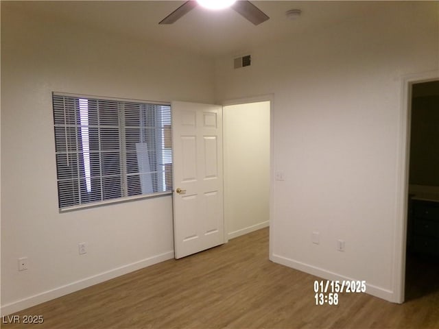 unfurnished bedroom featuring ceiling fan and hardwood / wood-style floors