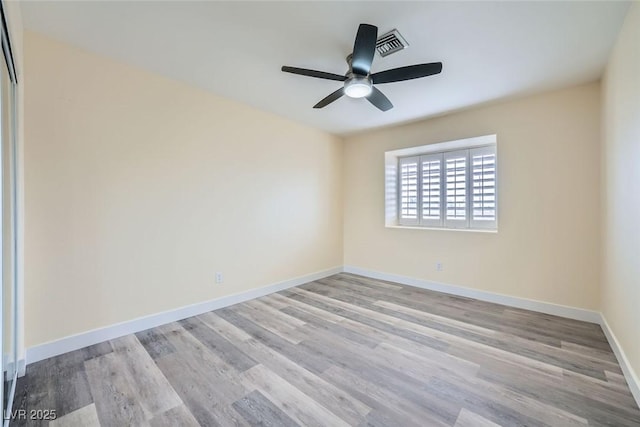 unfurnished room featuring light wood-type flooring and ceiling fan