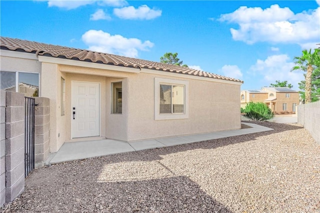 property entrance with a patio