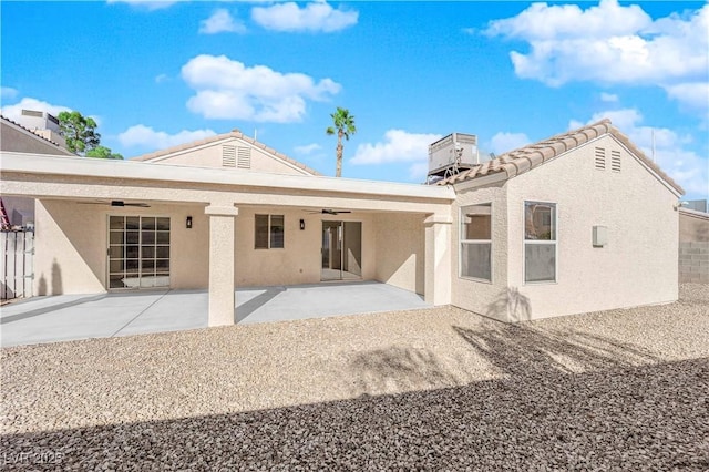 rear view of property featuring a patio area and cooling unit