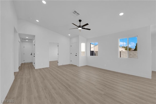 unfurnished living room featuring ceiling fan, lofted ceiling, and light hardwood / wood-style floors