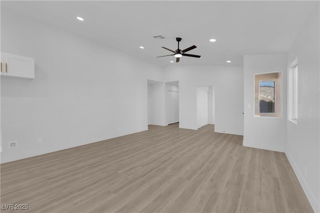 unfurnished living room featuring ceiling fan and light hardwood / wood-style floors