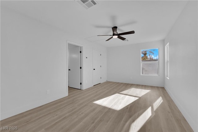 spare room with ceiling fan and light hardwood / wood-style flooring