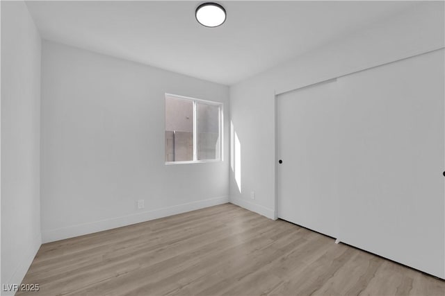 unfurnished room with light hardwood / wood-style flooring