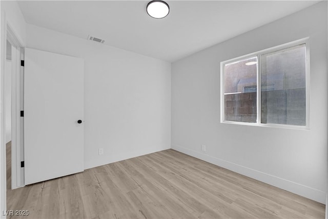 unfurnished room featuring light hardwood / wood-style floors