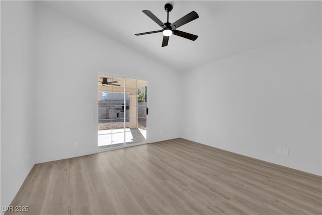 empty room with light wood-type flooring, ceiling fan, and high vaulted ceiling