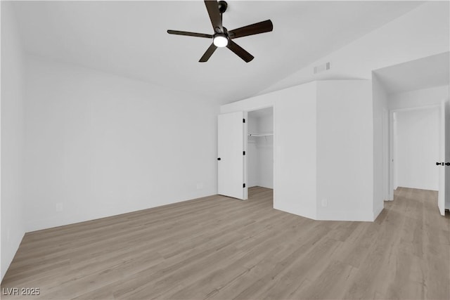 interior space with light hardwood / wood-style floors, lofted ceiling, and ceiling fan