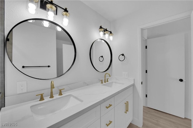 bathroom featuring wood-type flooring and vanity