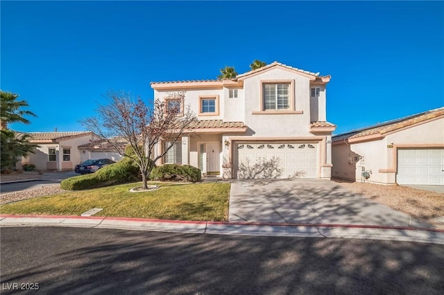 mediterranean / spanish-style house with a garage and a front lawn