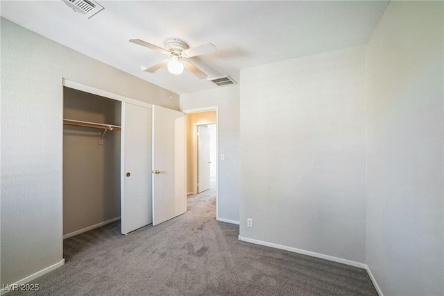 unfurnished bedroom with ceiling fan, a closet, and carpet floors