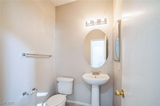 bathroom with toilet and sink