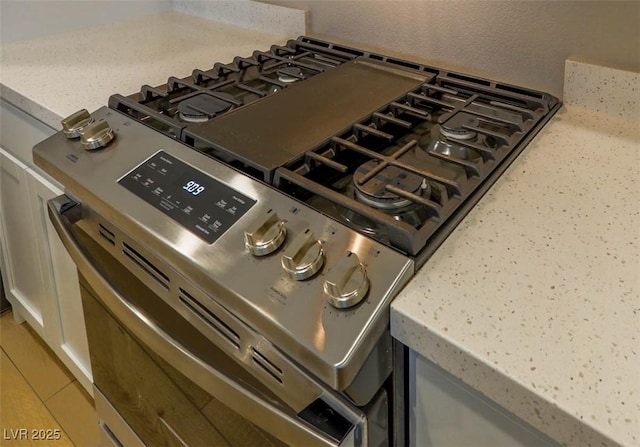 room details with stainless steel range with gas cooktop