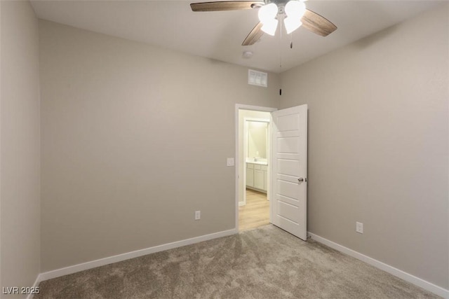 carpeted empty room with ceiling fan