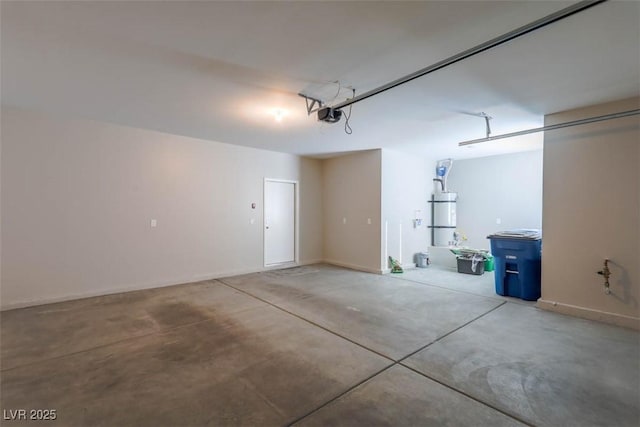 garage featuring water heater and a garage door opener