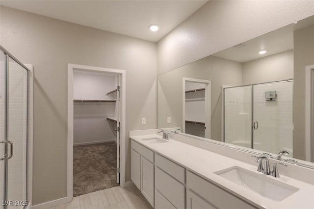 bathroom with an enclosed shower and vanity