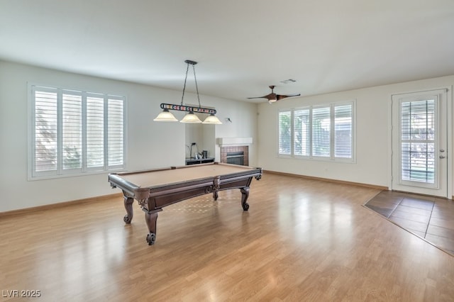 playroom featuring a fireplace, billiards, visible vents, baseboards, and light wood-type flooring