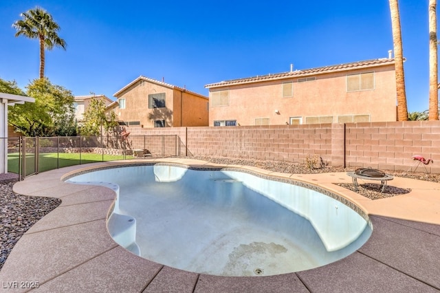 view of swimming pool with a fire pit