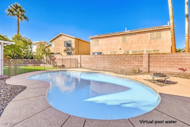 view of swimming pool with an outdoor fire pit