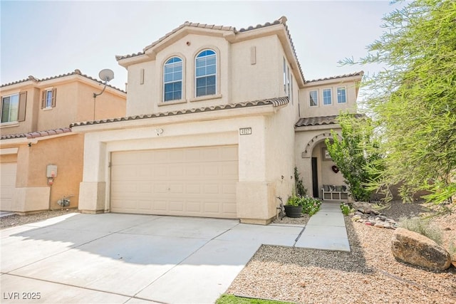 mediterranean / spanish-style house featuring a garage